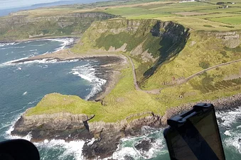 Flying over the Giant's Causeway in heli, Norther Ireland