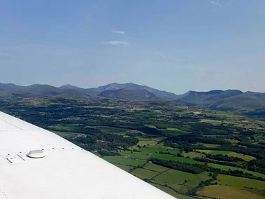 Fly to Shobdon for lunch and return over the Welsh Mountains