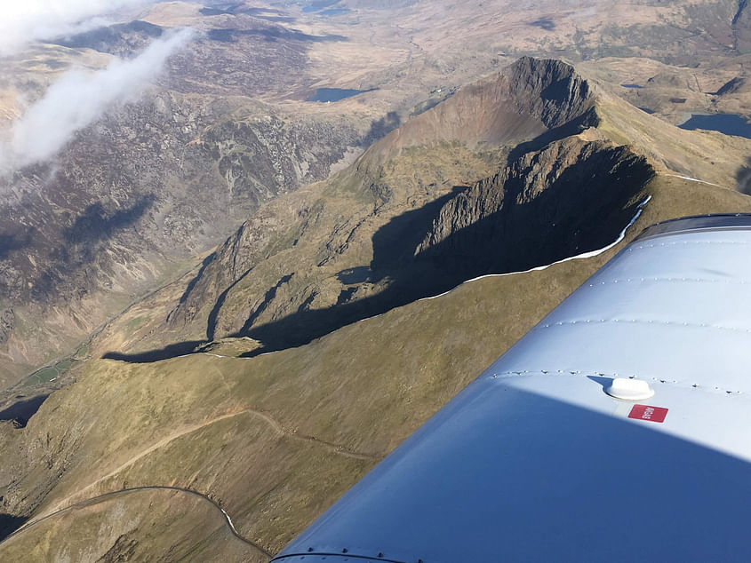 Fly to Caernarfon with short walk to beach or lunch in café