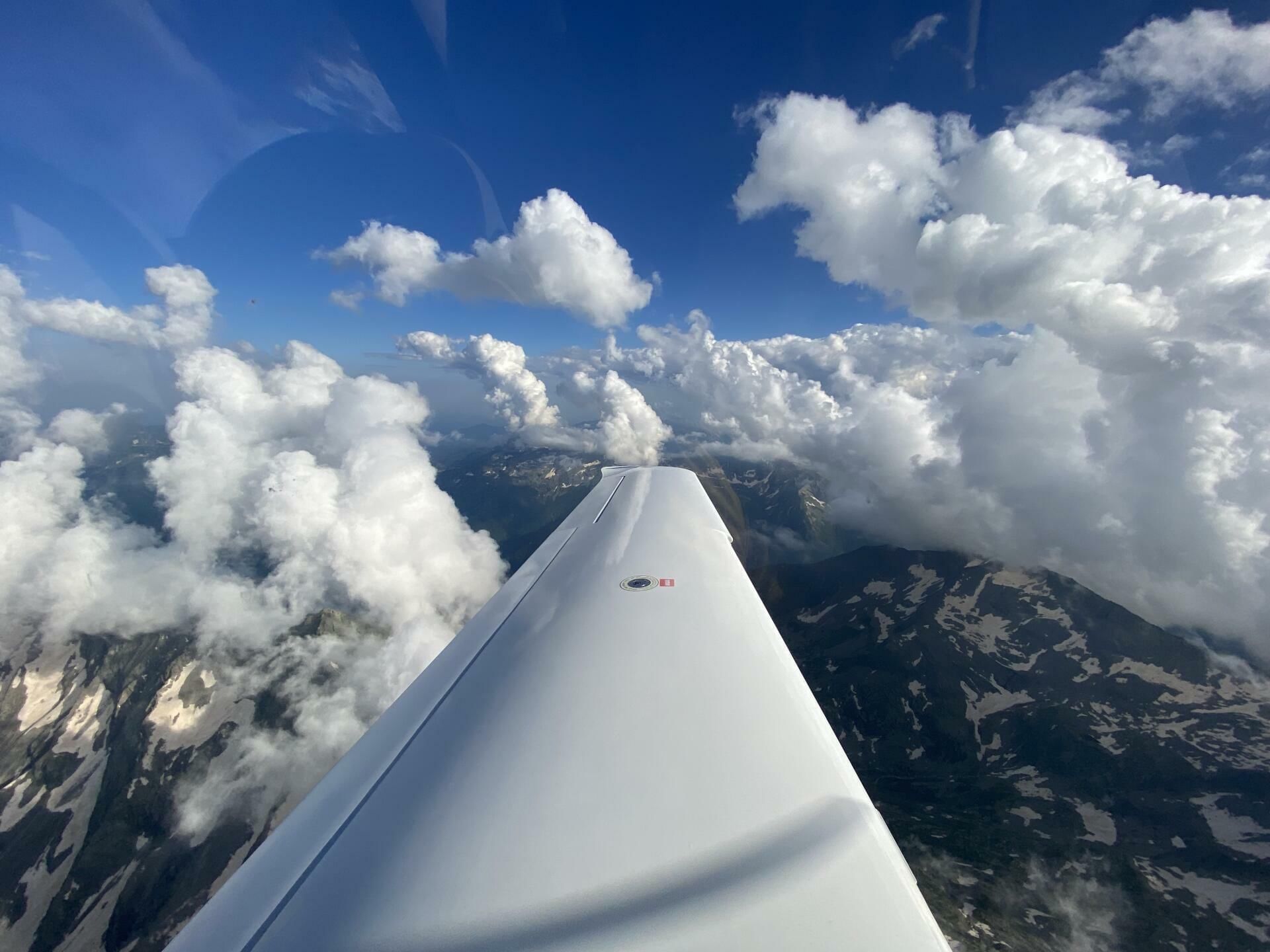 Climbing through the clouds towards the west