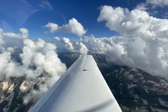 Climbing through the clouds towards the west