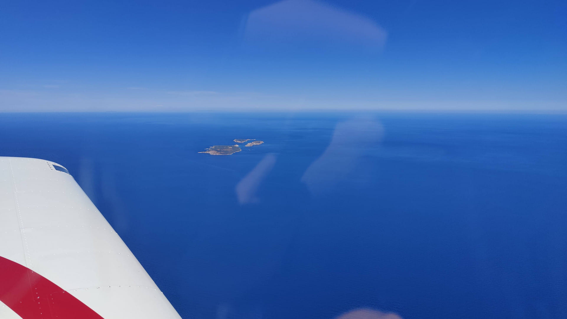 Flying oversees and spotting Greek islands