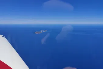 Flying oversees and spotting Greek islands