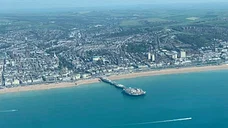 Flight over Brighton pier and coast