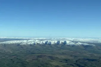 Crisp winter’s morning with snow covered hills