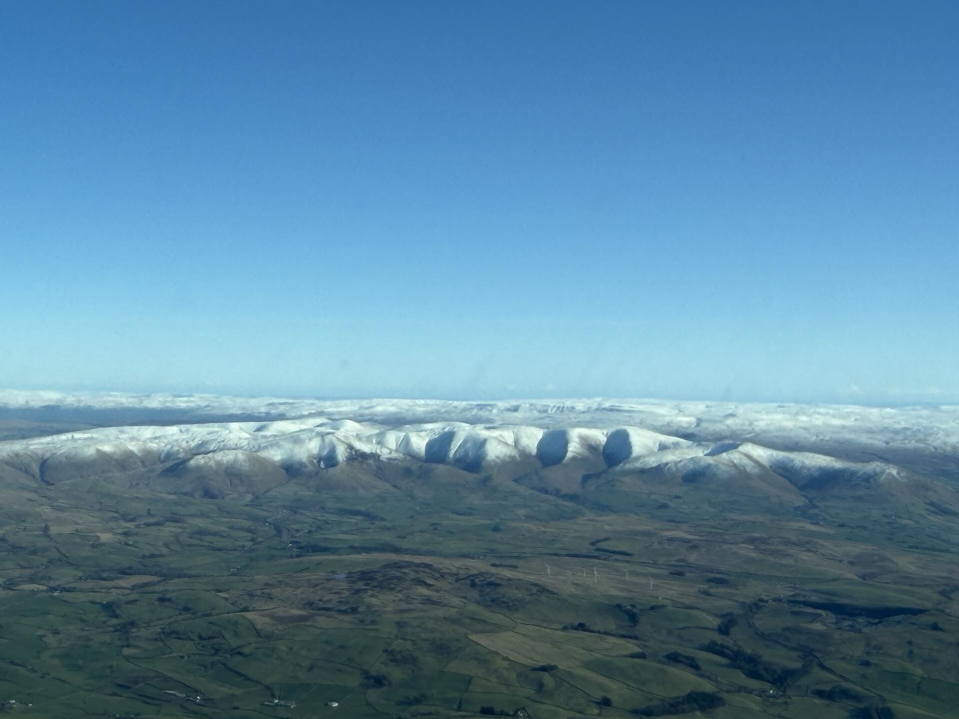 Crisp winter’s morning with snow covered hills