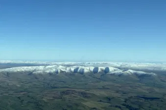 Crisp winter’s morning with snow covered hills