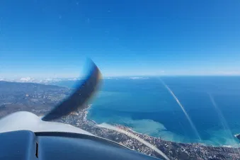 The blue waters on the shore are a wonderful sight from above!