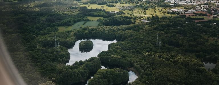 Aerial view of a landscape with a small lake