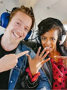 Woman pointing her wedding ring in aircraft