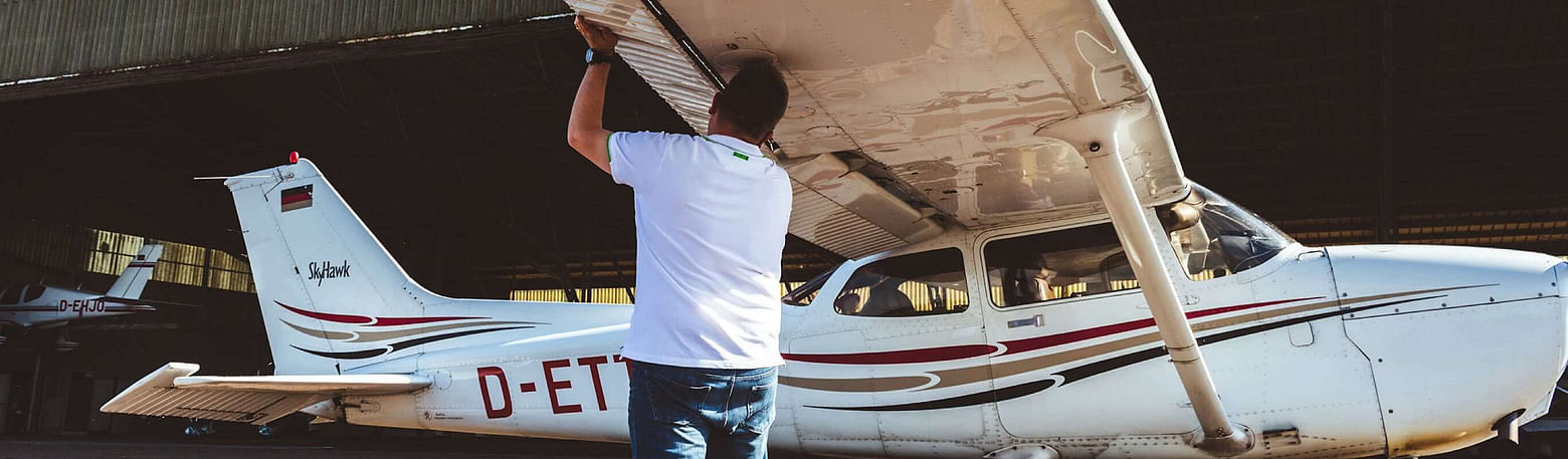 A pilot checks the airbrakes of the light aircraft